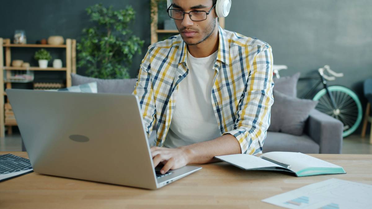 student researching graduate school no gre required options on laptop