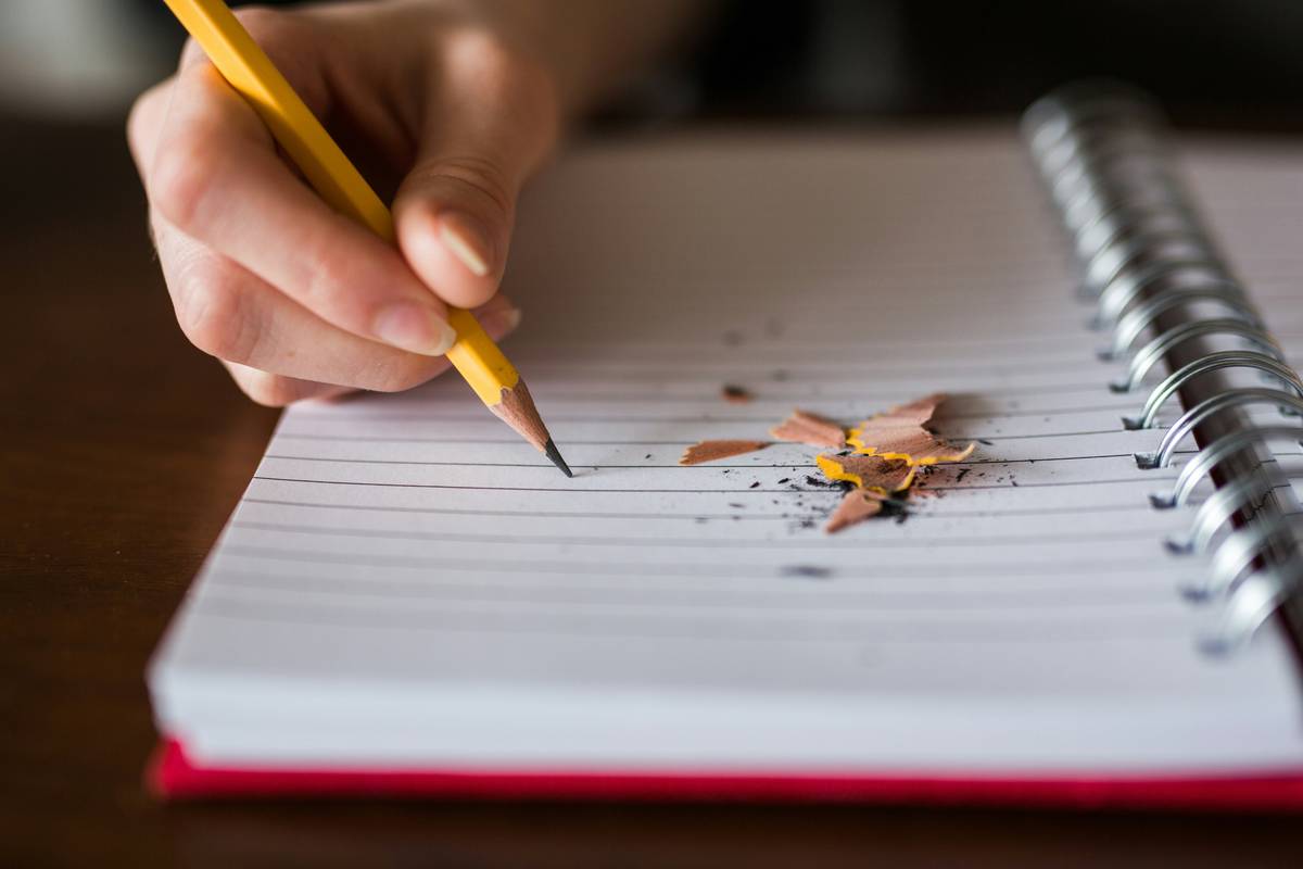 Student analyzing gre requirement for graduate school with annotated academic journal