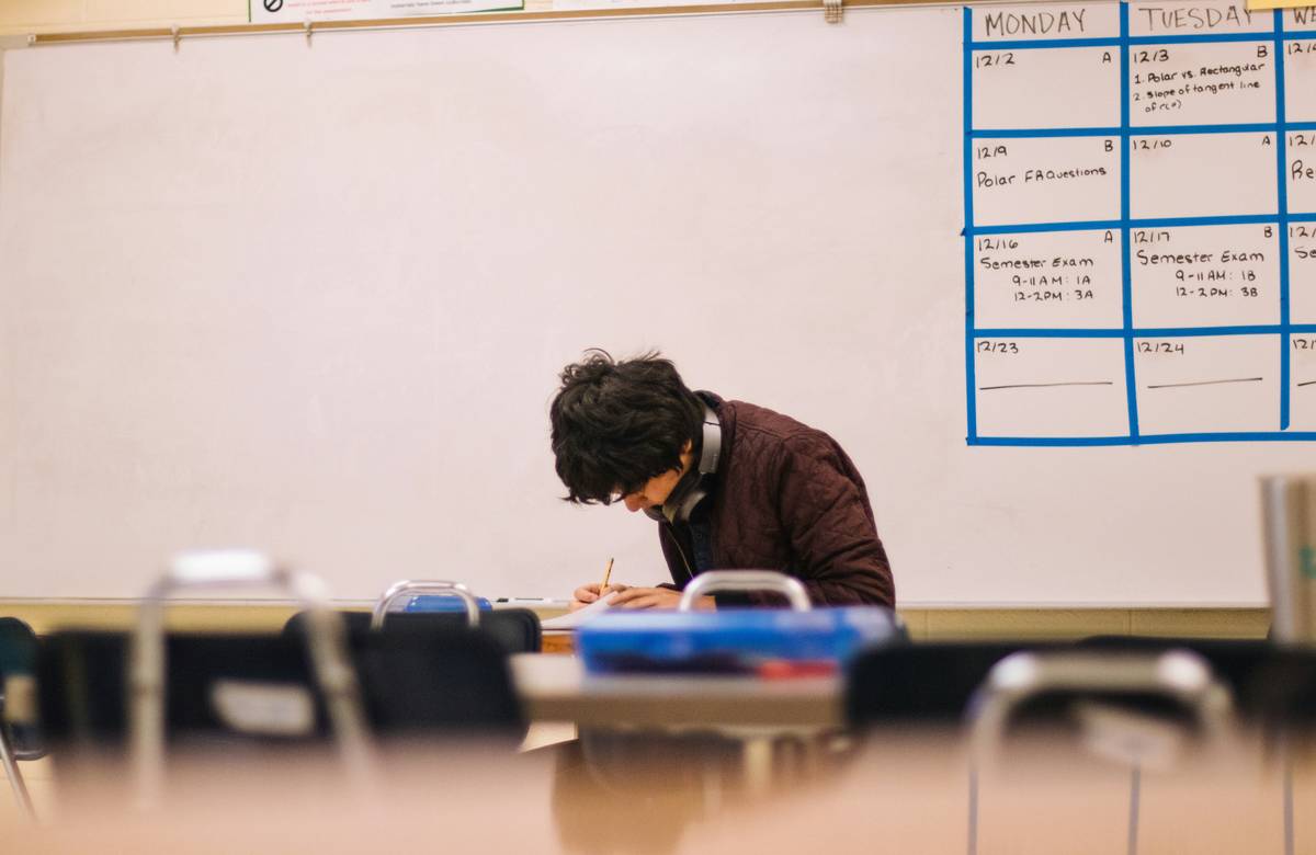 what is gre grad school: student analyzing GRE verbal reasoning practice test with highlighted passages